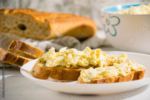Sandwich with egg and delicious whole grain baguette with sesame seeds. Nutritious breakfast concept