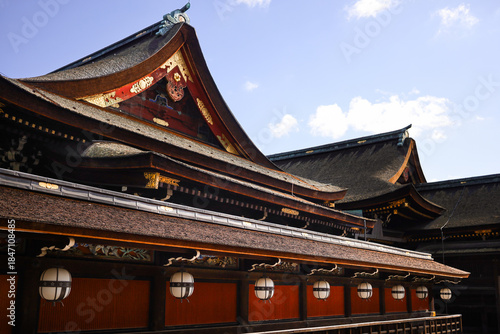 Traditional Japanese Temple Roofs, Lanterns, and Shinto Shrine Courtyard Architecture On A Sunny Day