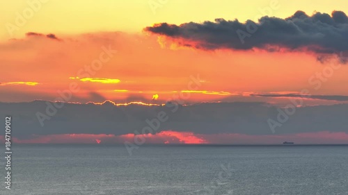 Sunset over sea, clouds, bird. Mediterranean sea, Malta