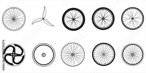 Assortment of bicycle wheels and propeller on white background Keywords: bicycle, wheel, bike, cycle, transportation, vehicle
