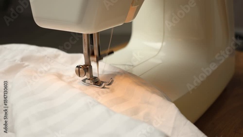 A close-up of the sewing process on a sewing machine