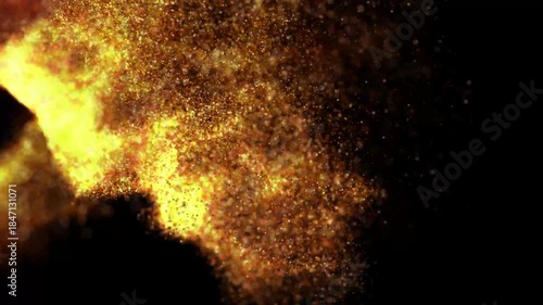 Explosion of golden particles against a dark background