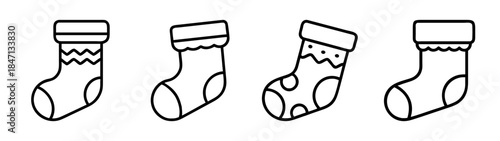 Simple line art illustrations of four christmas stockings with different patterns on white background