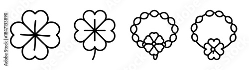 Various illustrations of four-leaf clovers and good luck charm designs in black and white line art