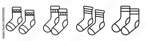 Line art collection of four pairs of socks featuring different cuff patterns