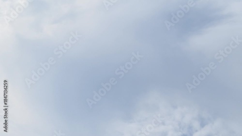 Timelapse shows clouds, sculpted by wind, drifting across the sky. Their majestic motion creates a peaceful, celestial dance. Change weather concept. Cloudscape time lapse. Nature background.