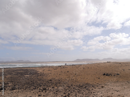 El Cotillo village - Fuerteventura island - Spain - December 4 2025 : Dramatic view of beautiful desert landscape, rugged coastline  and beach.