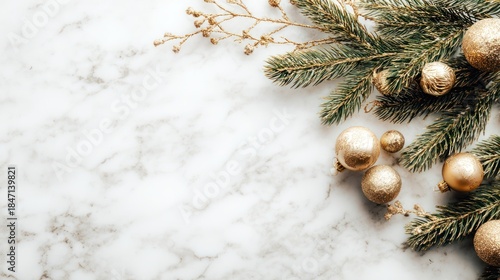 Fir tree branches and golden Christmas decorations on white marble background, flat lay, copy space