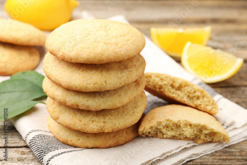 Wallpaper Mural Tasty lemon cookies and fruit slices on wooden table, closeup Torontodigital.ca