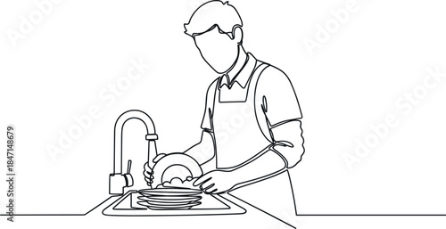 Man washing dishes in kitchen sink with soap and water, daily household chore