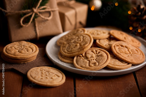 Christmas butter cookies with cinnamon and decorations, close-up shot
