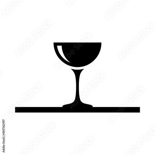 Cocktail glass on bar counter silhouette vector illustration