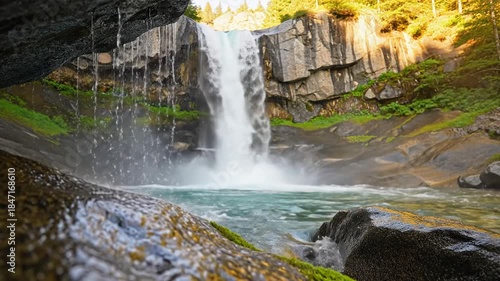 Majestic Waterfall Cascading into a Serene Pool in a Lush Forest Landscape.