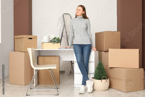 Young woman in rented offic...
