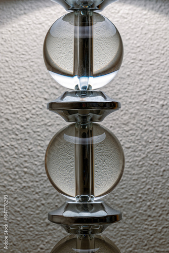 Detail of the glass globes on the column and pipe of a decorative table lamp