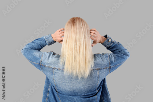 Young man with long blonde ...