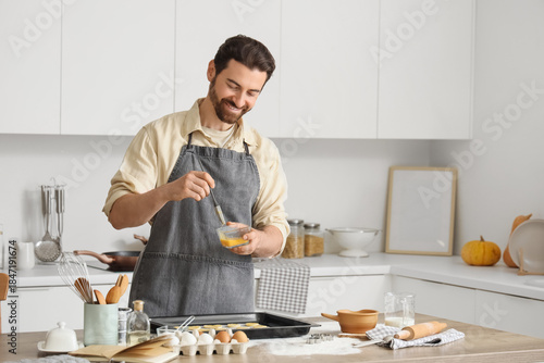 Young man preparing cookies...
