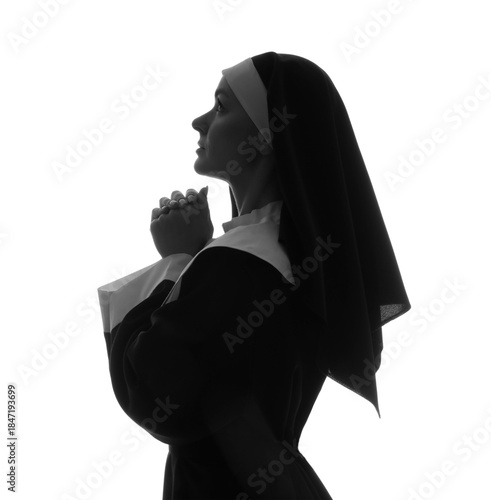 Silhouette of praying nun o...