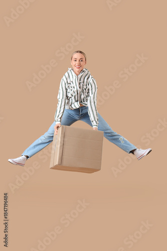 Young woman with parcel box...