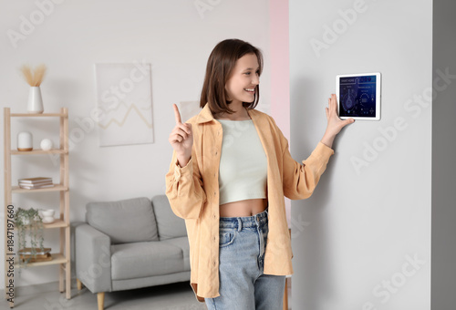 Young happy woman using sma...