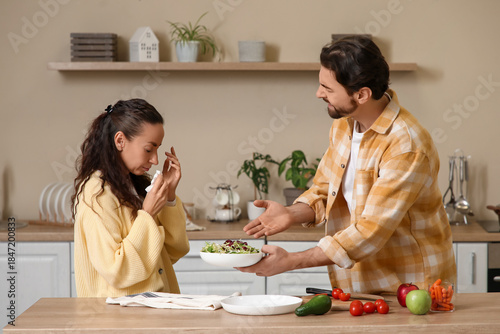 Unhappy couple quarreling i...