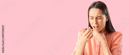 Young woman with syrup for ...