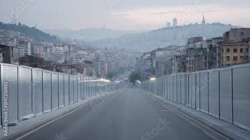 Medium shot of sound barriers installed near residential areas to reduce aircraft noise pollution affecting local communities.