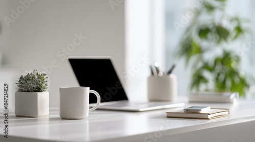 Minimalist Workplace with Laptop, Cactus, Coffee Cup and Elegant Stationery