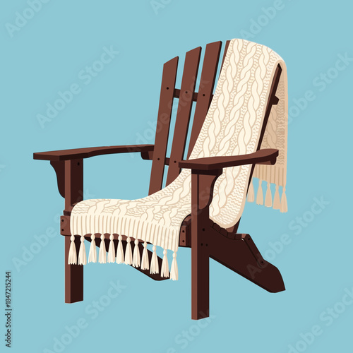 Comfortable wooden Adirondack chair with cushioned and tasseled throw blanket on a solid blue