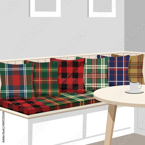 Cozy corner with colorful plaid cushions and a simple white table in a modern interior
