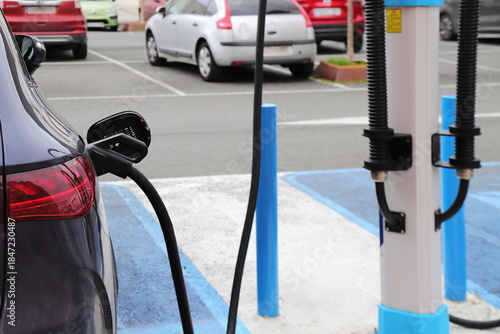 Electric car charge station, eco friendly recharge on parking