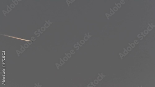 Tokyo, Japan - December 15, 2025: Contrail or airplane track at dusk
