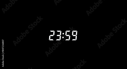 Digital clock display showing the time 23:59 on a black background, indicating the last minute of the day
