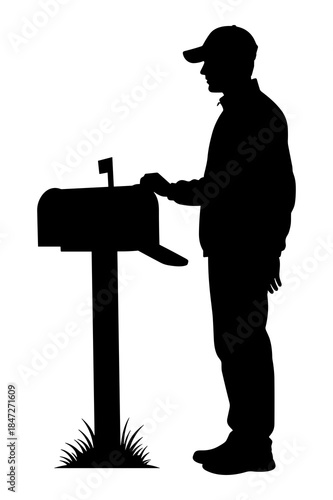 Silhouette of a person checking mail at a curbside residential mailbox post