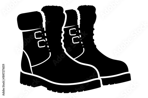 Silhouette of two pairs of warm winter boots with fur lining for cold weather