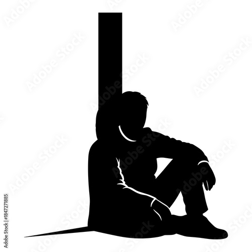 Silhouette of a lonely person sitting against a tall vertical structure outdoors