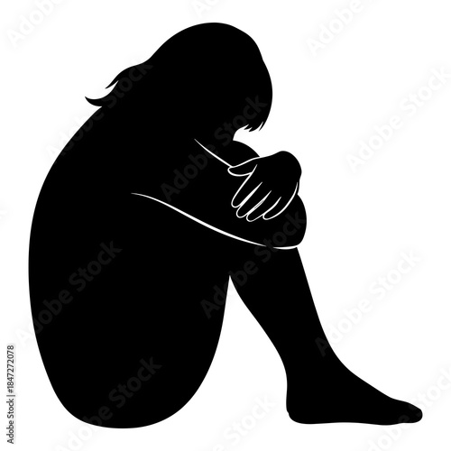 Silhouette of a person curled up in a fetal position symbolizing distress and sadness