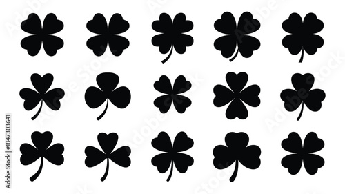 A collection of lucky black shamrock and four leaf clover silhouettes arranged on a clean white background