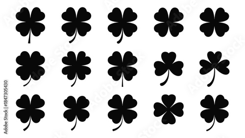 A grid of black four leaf clovers and three leaf shamrock shapes on a white field