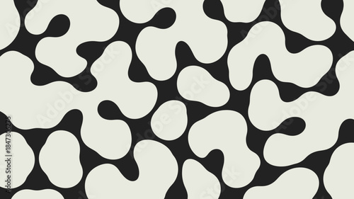 A repeating pattern showcases black and off white irregular amorphous shapes scattered randomly across the surface