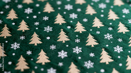 Green fabric with repeating pattern of beige Christmas trees and white snowflakes
