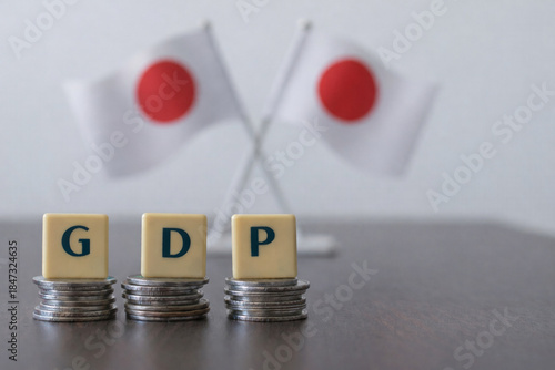 Japan GDP concept with stacked coins and blocks, highlighting national output, global ranking, yen dynamics, dedollarisation debate, demand trends, tariff effects, interest rate policy and IMF views