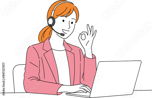 Smiling female customer service representative or telemarketer wearing a headset while working on a laptop and giving an "OK" gesture
