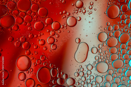 Close up of oil drops on water surface. Colorful abstract macro background of oil drops on water surface with air bubbles inside. Colorful background for gadget and computer wallpaper