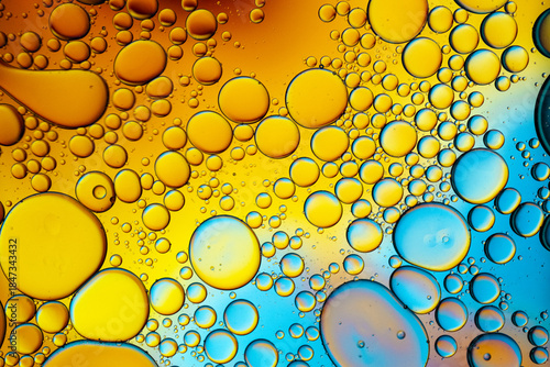 Close up of oil drops on water surface. Colorful abstract macro background of oil drops on water surface with air bubbles inside. Colorful background for gadget and computer wallpaper