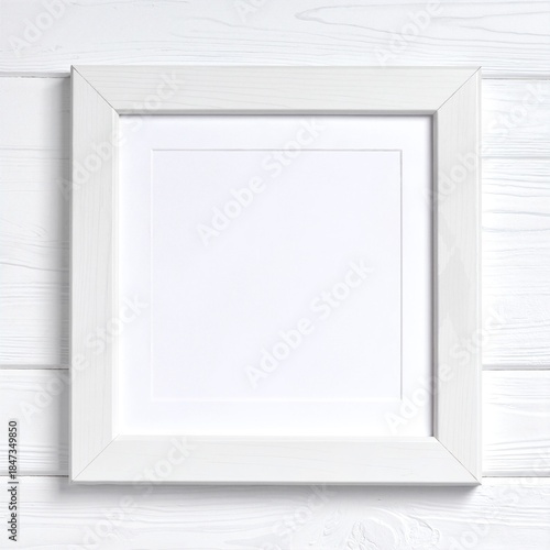 A rustic wooden background showcases a sleek white frame, perfect for displaying cherished photos or artwork, adding a touch of elegance to any space.
