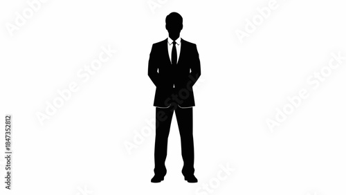 Silhouette of a man in a suit standing confidently.