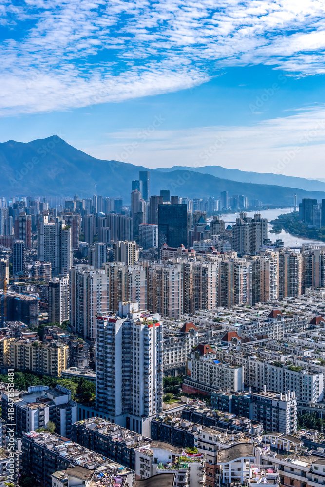 Fototapeta premium Urban Skyline with High-rise Buildings and River