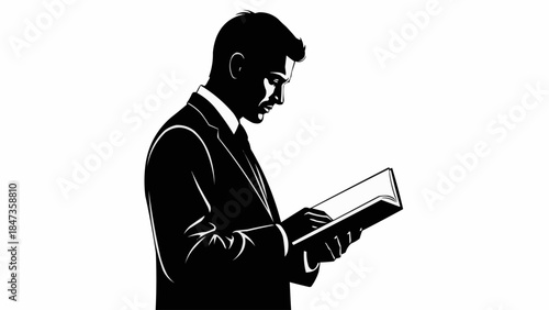 Silhouette of a man in a suit reading a book intently.