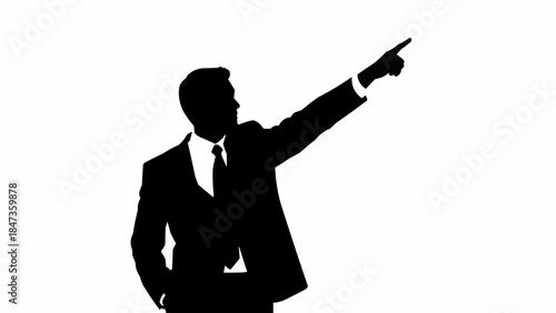 Silhouette of a businessman pointing upwards with determination and confidence.